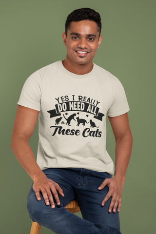 Humorous Cat Lover T-Shirt - 'Yes I Really Do Need All These Cats' Bold Graphic Design in Monochrome - Playful Cat Silhouettes & Heart Accents on Gray Unisex Crew Tee