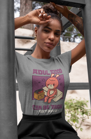 Women’s Cotton T-Shirt – “Adulthood Can Be Tough, Don’t Grow Up” Funny Cartoon Graphic Tee