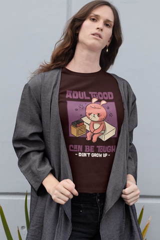 Women’s Cotton T-Shirt – “Adulthood Can Be Tough, Don’t Grow Up” Funny Cartoon Graphic Tee